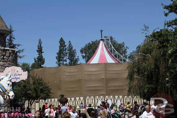 The canopy of the carrousel is being worked on.