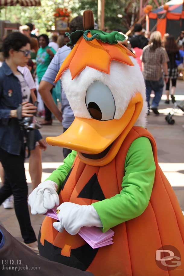 Donald dressed up and signing autographs.