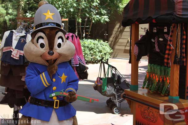 Chip keeping the peace at the merchandise cart with a gun he borrowed from the display.