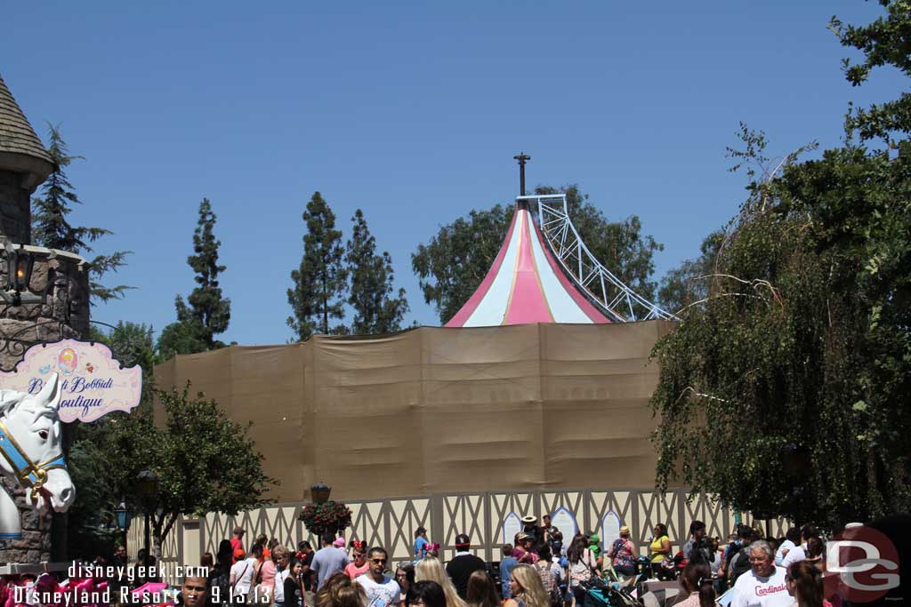 The canopy of the carrousel is being worked on.