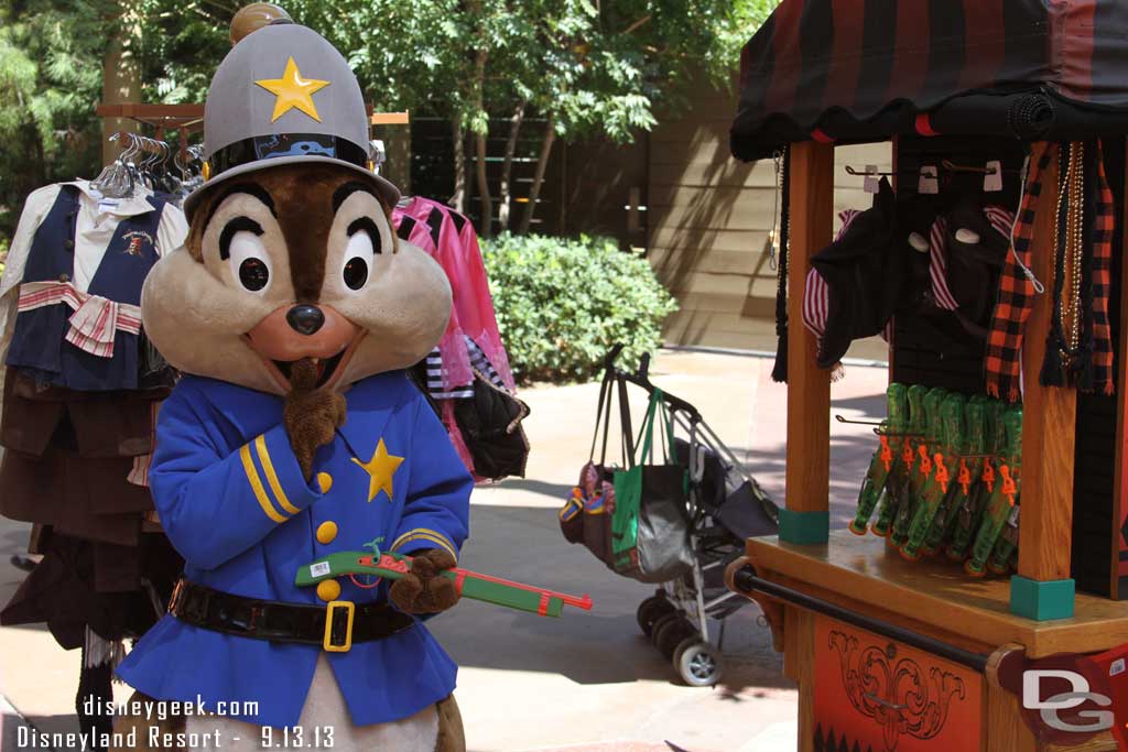 Chip keeping the peace at the merchandise cart with a gun he borrowed from the display.