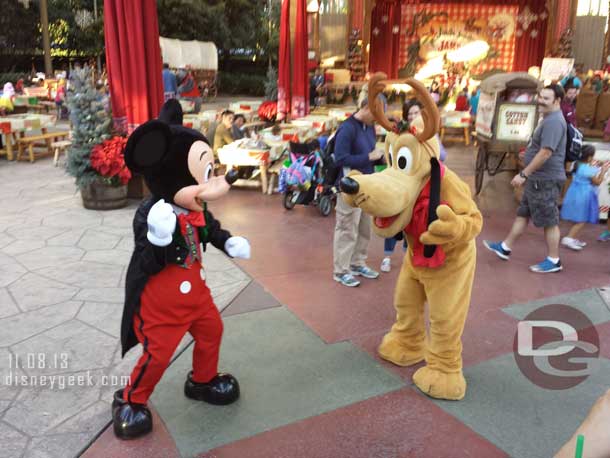 Mickey and Pluto goofying around. Mickey was pretending to throw a ball and Pluto would look for it.