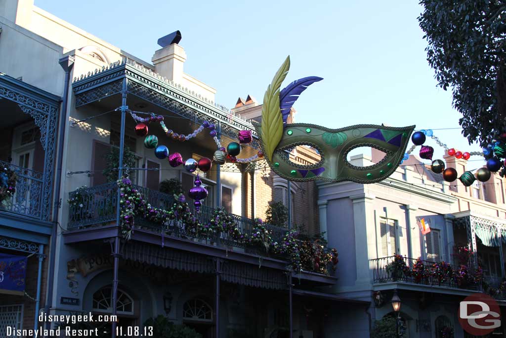 New Orleans Square features a mask over the entrance this year.