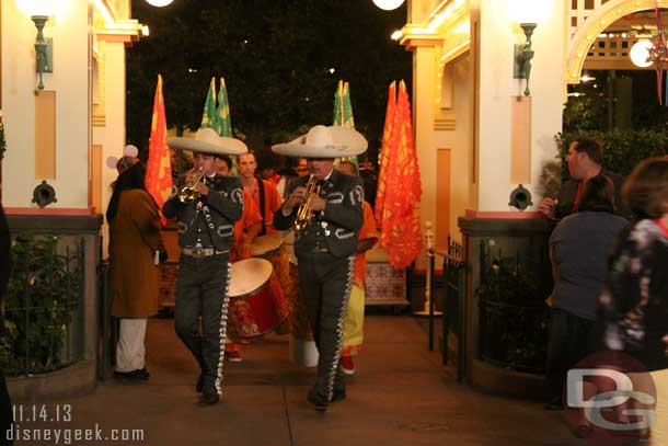 Before the street party some of the performers had a procession through the gardens.