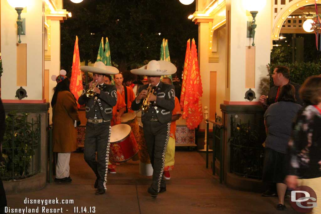 Before the street party some of the performers had a procession through the gardens.