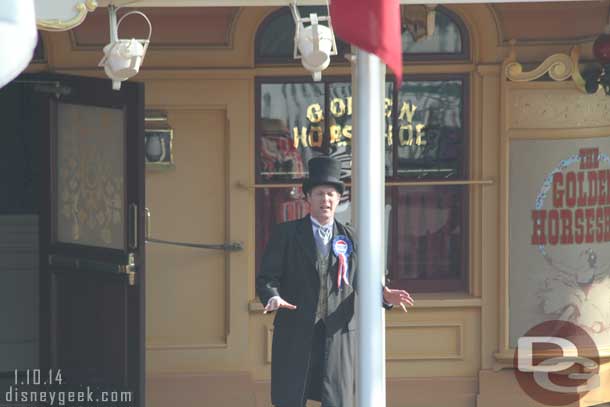 The mayor out in Frontierland asking/begging people to go inside the Golden Horseshoe and catch the show.