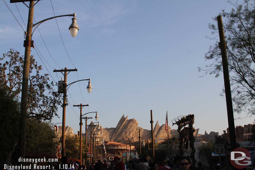 Cars Land is about halfway back to normal.  The overhead decorations and some of the other lights have been removed.  