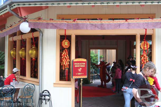 Mulan and Mushu were in a meet and greet location.