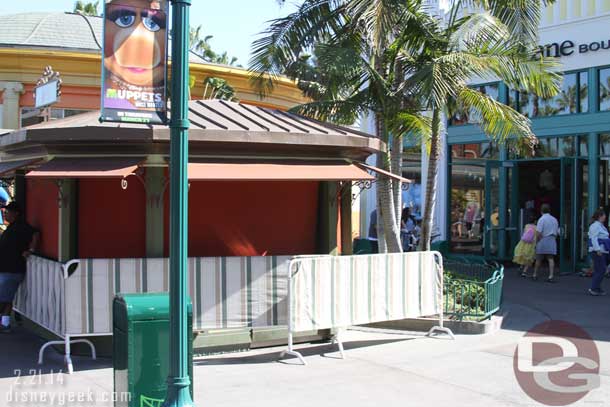 The Cupcake Kiosk is behind barriers.