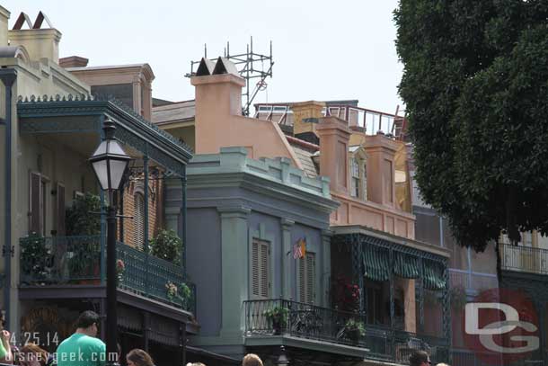 Working on the roof tops of New Orleans Square.  Guessing its fall protection work but maybe something to do with Club 33 work.