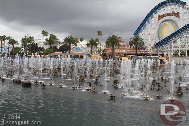 They were testing the World of Color fountains.  Speaking of which does anyone know if the 9:45pm show went ahead or was it cancelled because of rain?