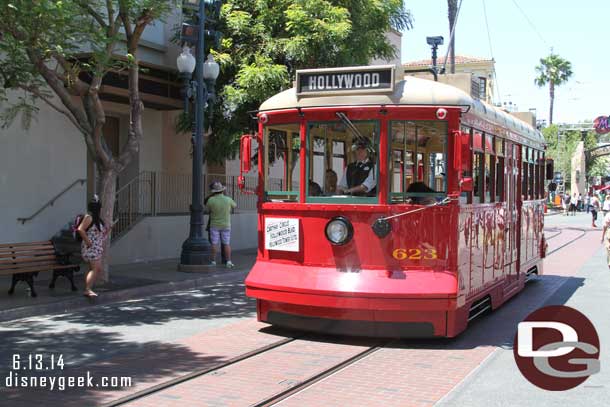 A Red Car Trolley passing by.