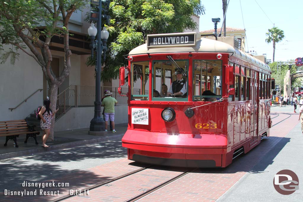 A Red Car Trolley passing by.