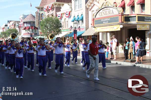 The All American College Band marching down Main Street USA to Town Square for the nightly Flag Retreat.