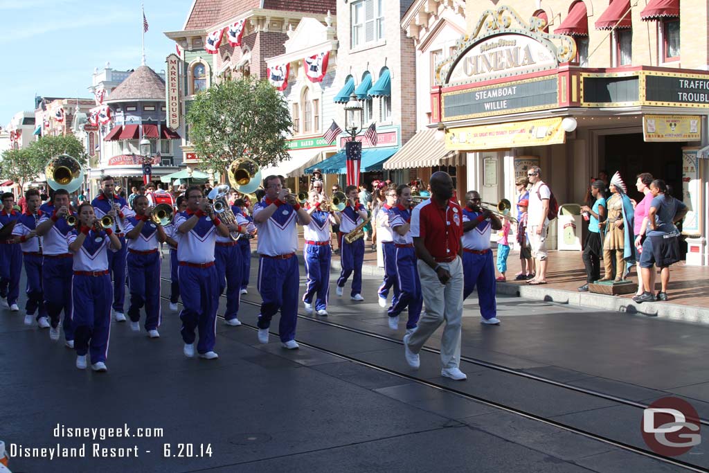 The All American College Band marching down Main Street USA to Town Square for the nightly Flag Retreat.