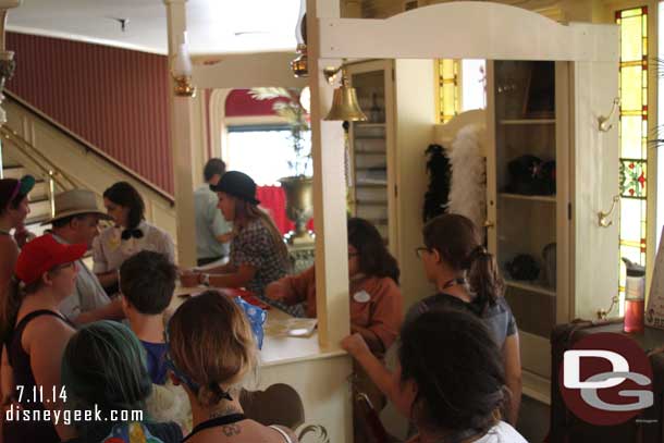 Guests making signs and interacting with Cast Members