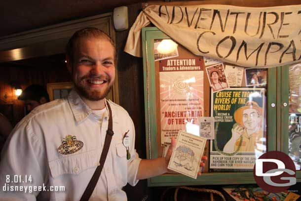 Several Cast Members were in the store to explain the scenarios and issue you an Adventure Name.  Here he is explaining about the  Piranahaha Juju.  You purchase this guide then go to the Jungle Cruise to learn about being a skipper.  Once completed you get the book stamped then return to get the Juju.