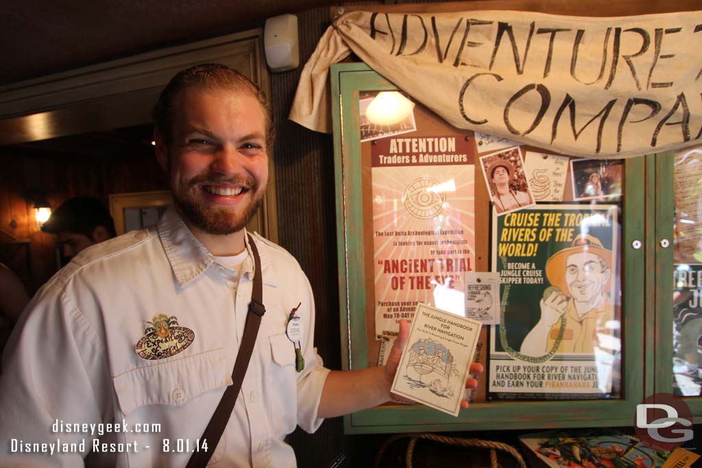 Several Cast Members were in the store to explain the scenarios and issue you an Adventure Name.  Here he is explaining about the  Piranahaha Juju.  You purchase this guide then go to the Jungle Cruise to learn about being a skipper.  Once completed you get the book stamped then return to get the Juju.