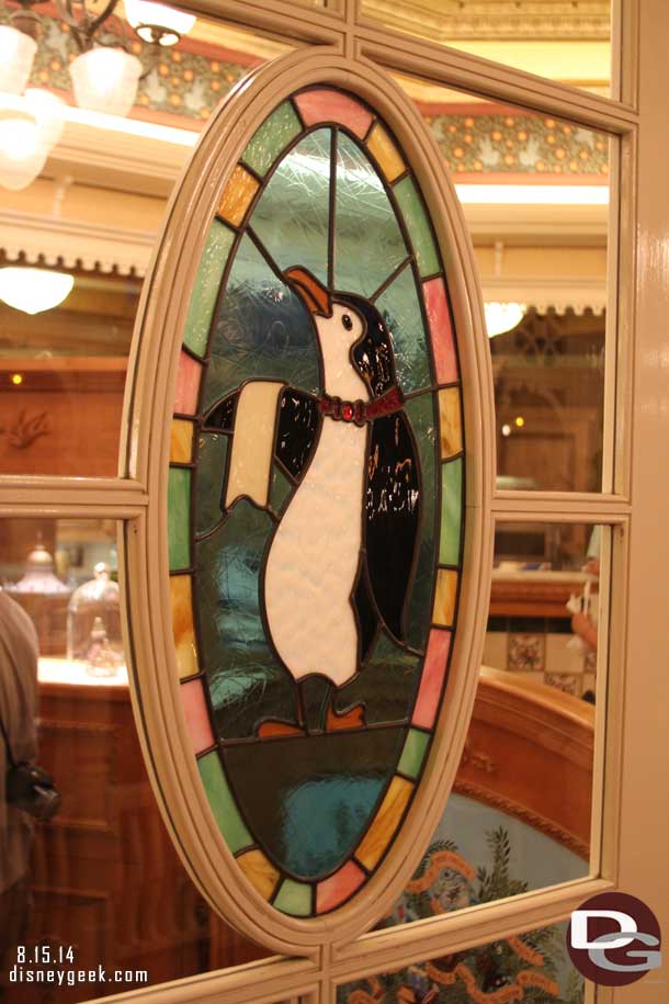 A penguin in the window of the Jolly Holiday Bakery