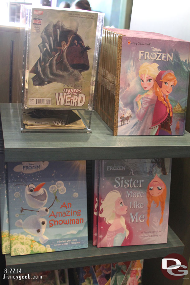 Several Frozen books and not sure why a Marvel comic was on the same rack.