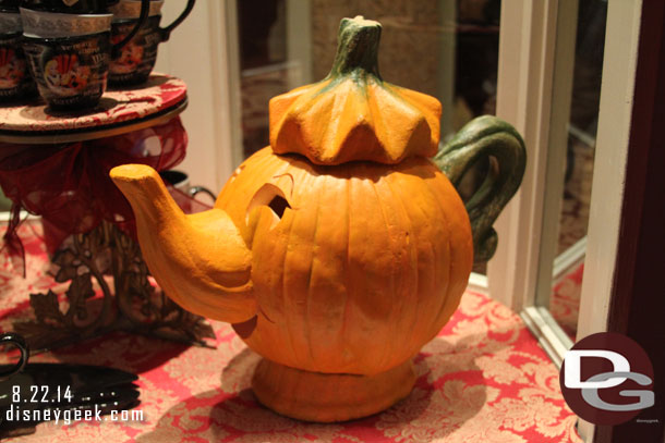 A pumpkin Mrs. Potts in the window.