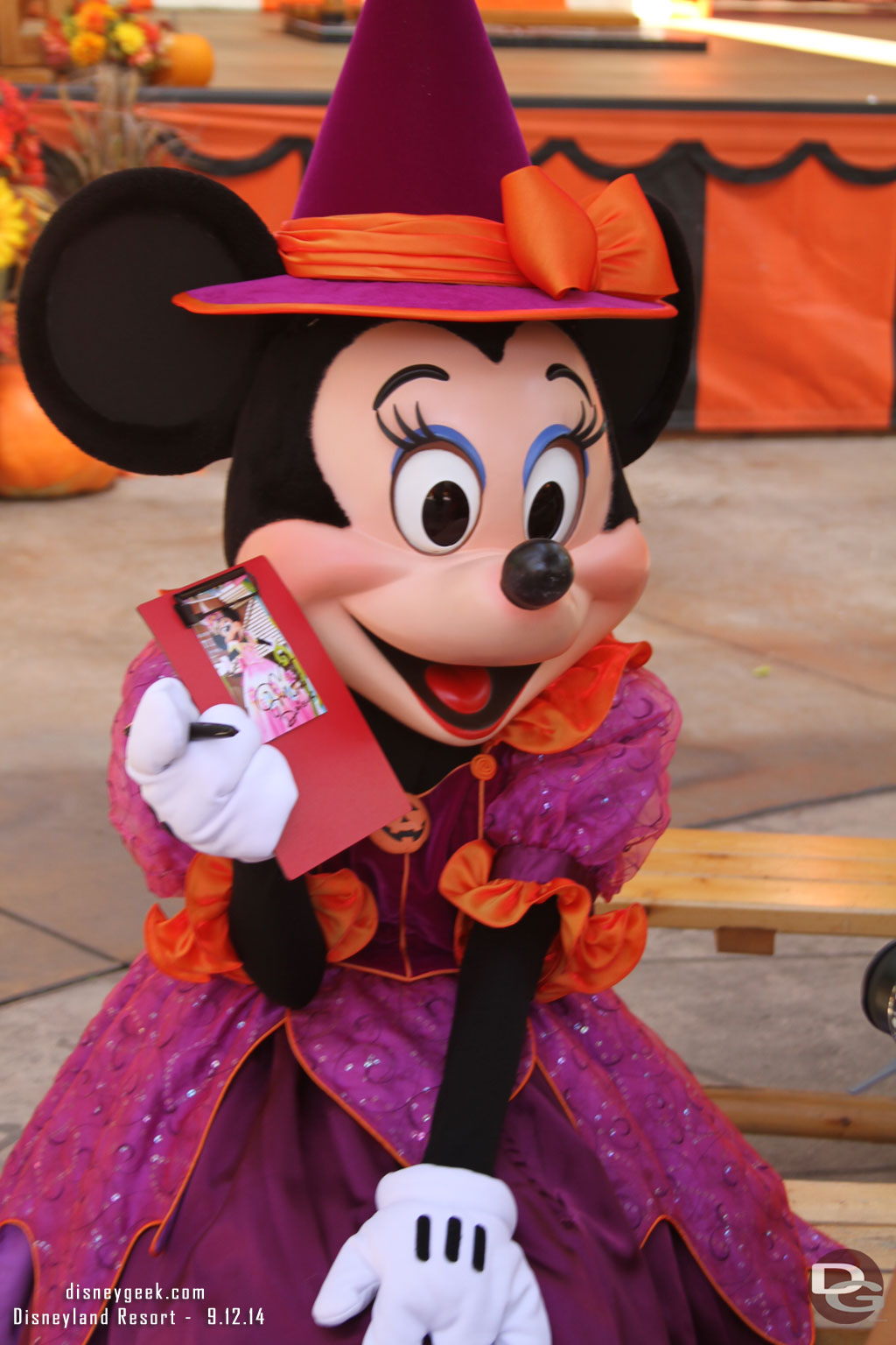 Characters were roaming around as usual.  Here Minnie is signing a picture for a guest.