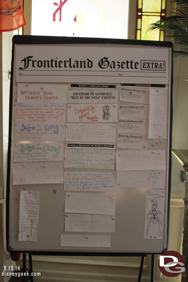 Inside the Golden Horseshoe a Frontierland Gazette board.