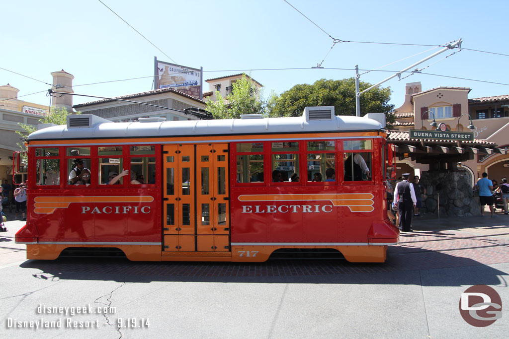 A Red Car pulling into the stop.