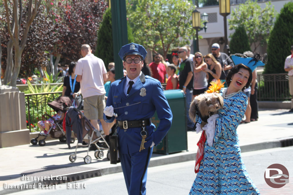 Officer Calvin Blue escorting Donna the Dog Lady down Buena Vista Street.