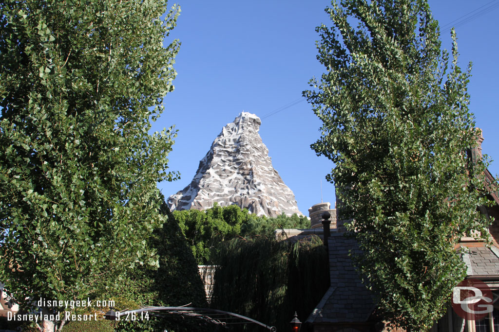 The Matterhorn towering over the queue for Mr. Toad