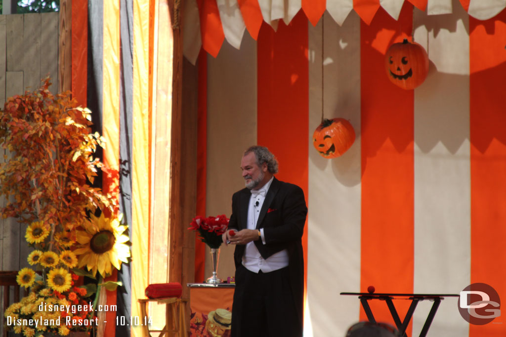 A magician was out on the stage performing.