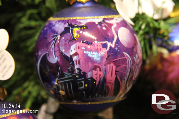 An interesting selection on the ornament.. Tower of Terror, Haunted Mansion, and Maleficent representing Fantasmic.