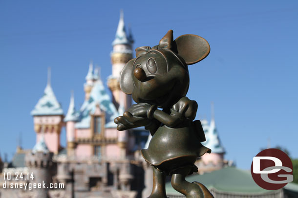 Random Minnie picture with a snowy Sleeping Beauty Castle in the background.