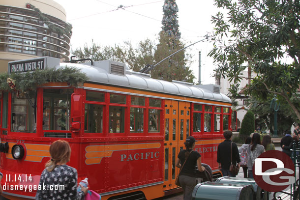 A Red Car Trolley was parked out on the street for pictures.