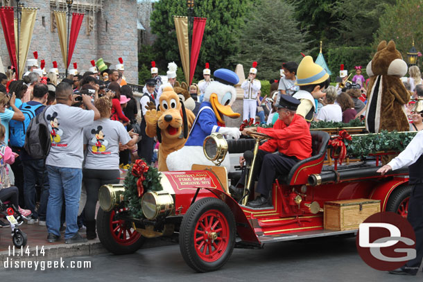 Some of the characters boarding the fire truck for a ride to Town Square.