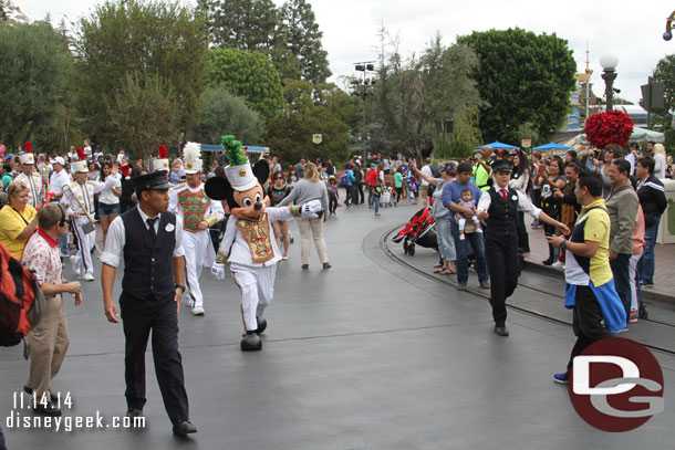 Mickey leading the band down the street.