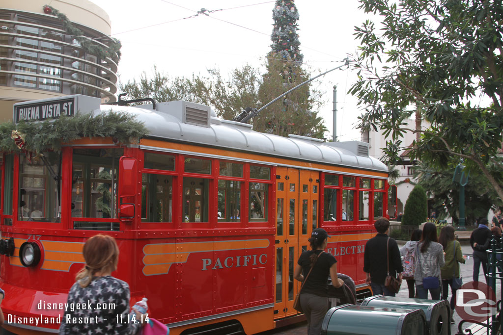 A Red Car Trolley was parked out on the street for pictures.