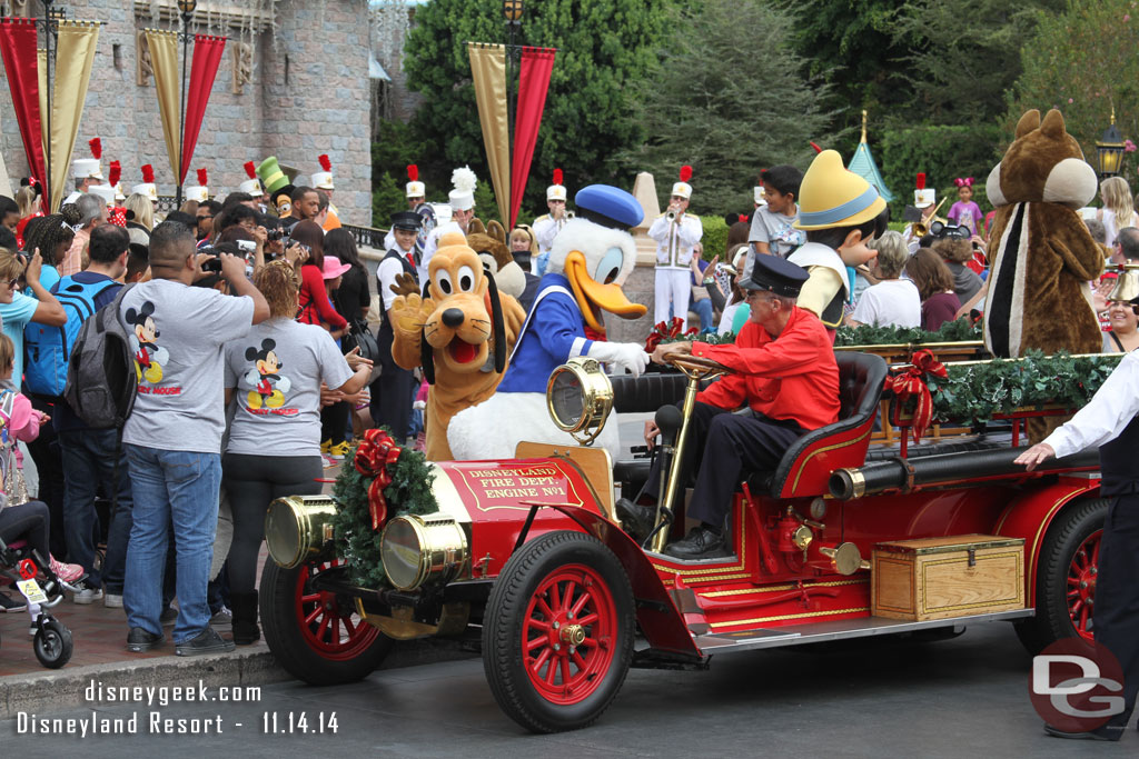 Some of the characters boarding the fire truck for a ride to Town Square.