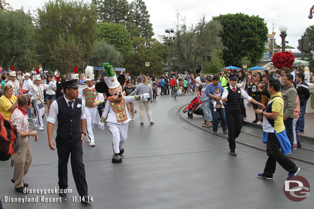 Mickey leading the band down the street.