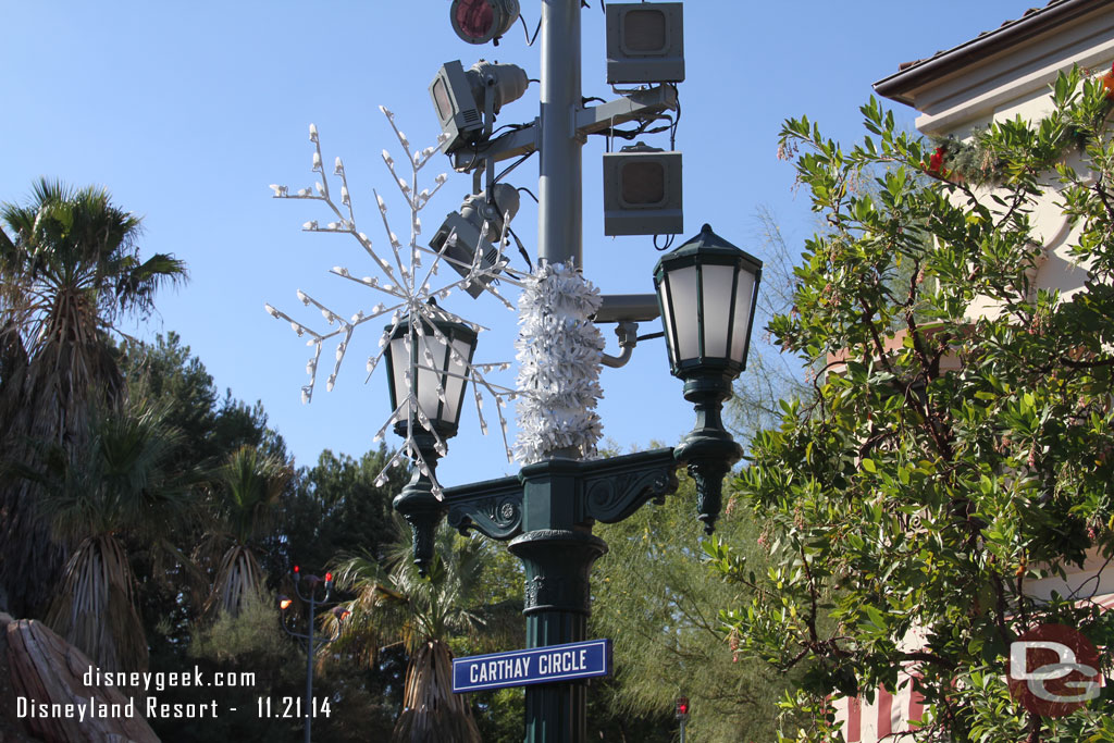 A minor tweak to the snow flake lights since last week.  More garland has been added to cover the supports/where it connects to the poles.