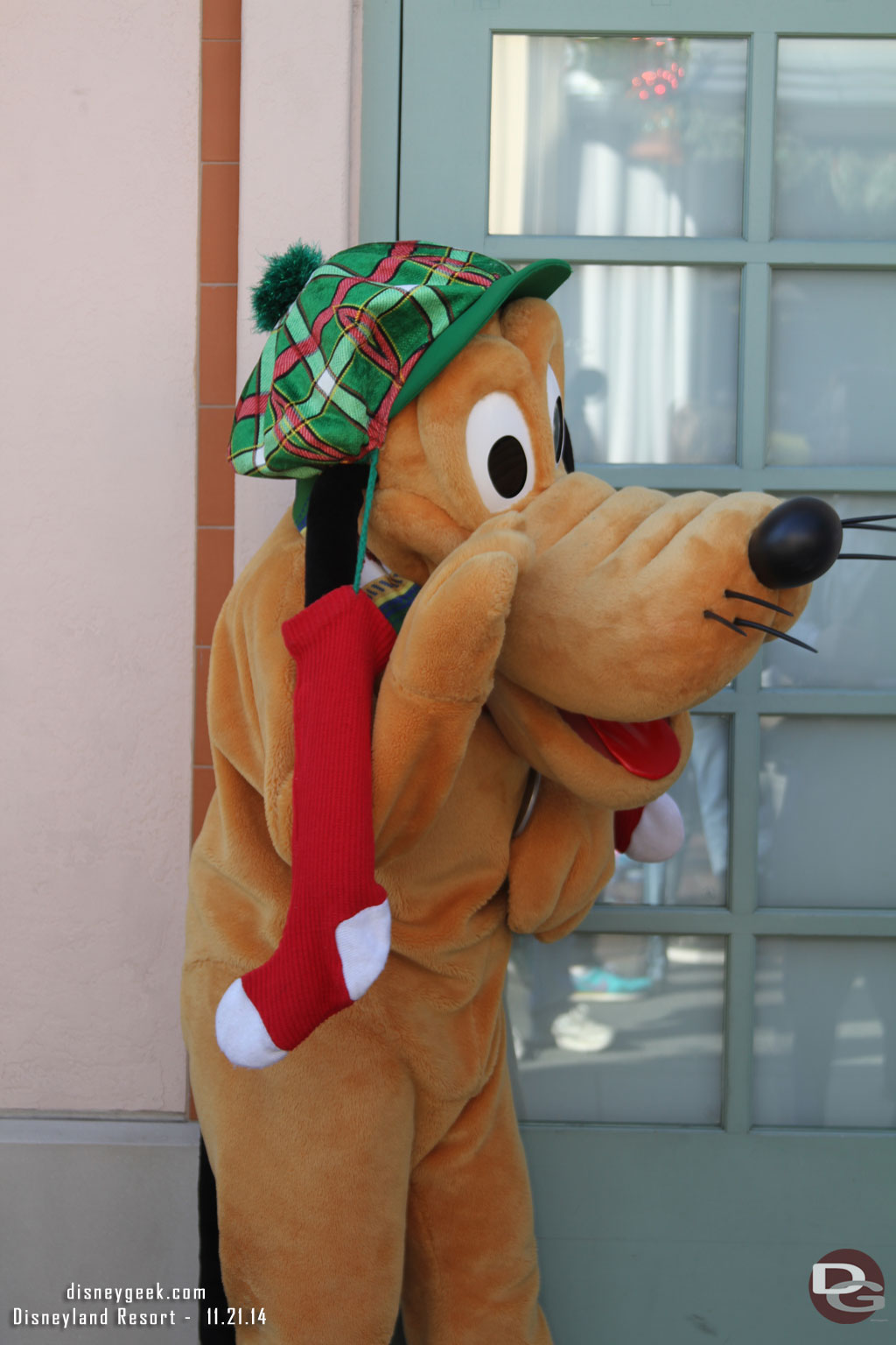 Pluto greeting guests on Buena Vista Street