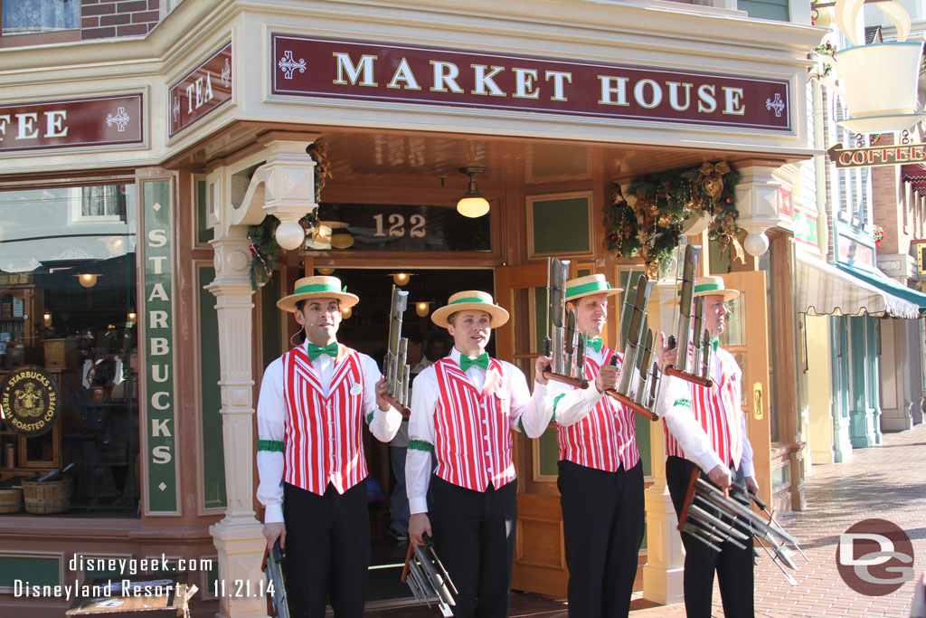 The Dapper Dans of Disneyland performing outside the Market House