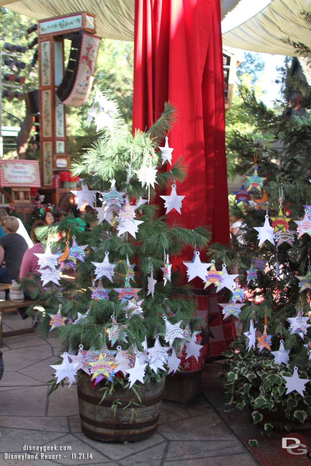 Stars that were decorated by guests hanging on the trees.