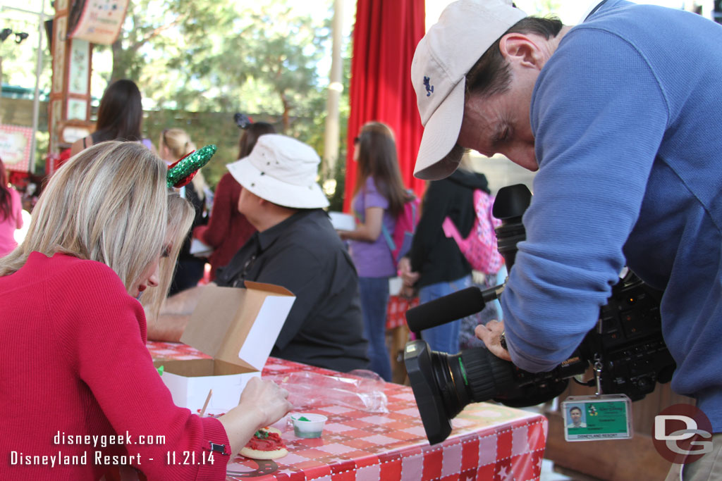 A reporter sat near by doing a segment on cookie decorating (mid show).  There was a media event going on with radio stations and others around the park for the holiday kickoff.