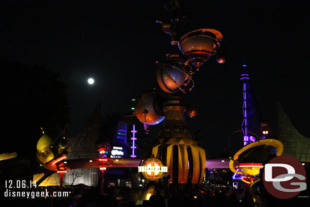 A full moon rising above Tomorrowland.