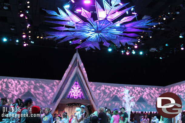 Inside there is a facade up around the around perimeter of the room and a giant snow flake overhead.