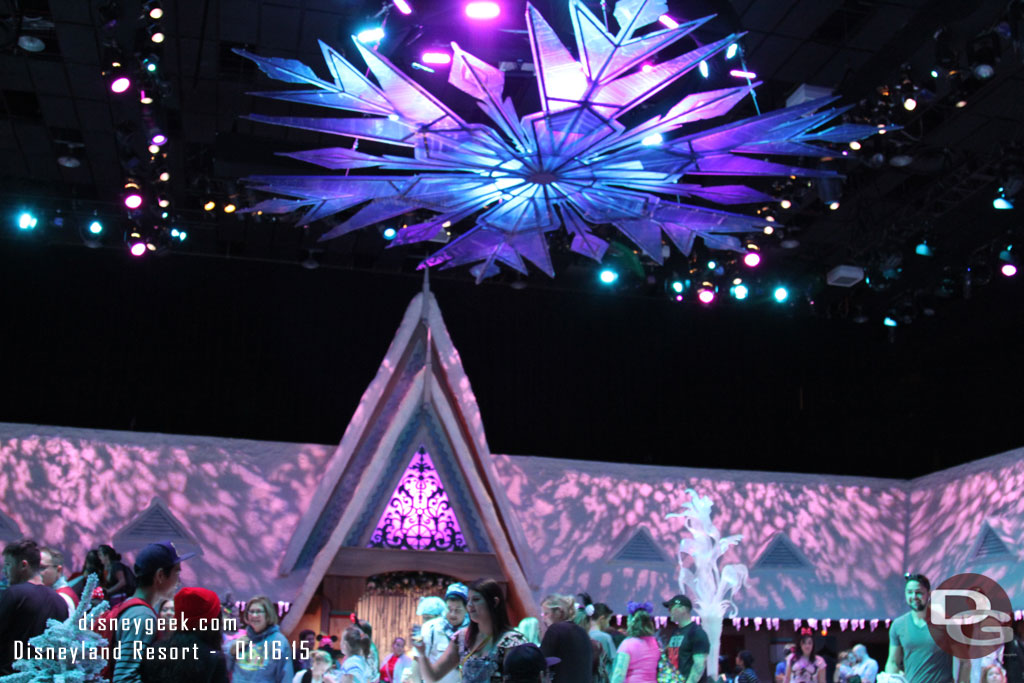 Inside there is a facade up around the around perimeter of the room and a giant snow flake overhead.