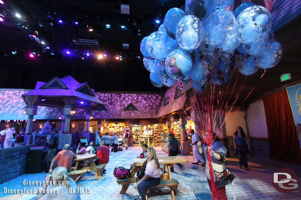 A wider shot of the couple tables and the merchandise area.  Also a balloon vendor on the way out.