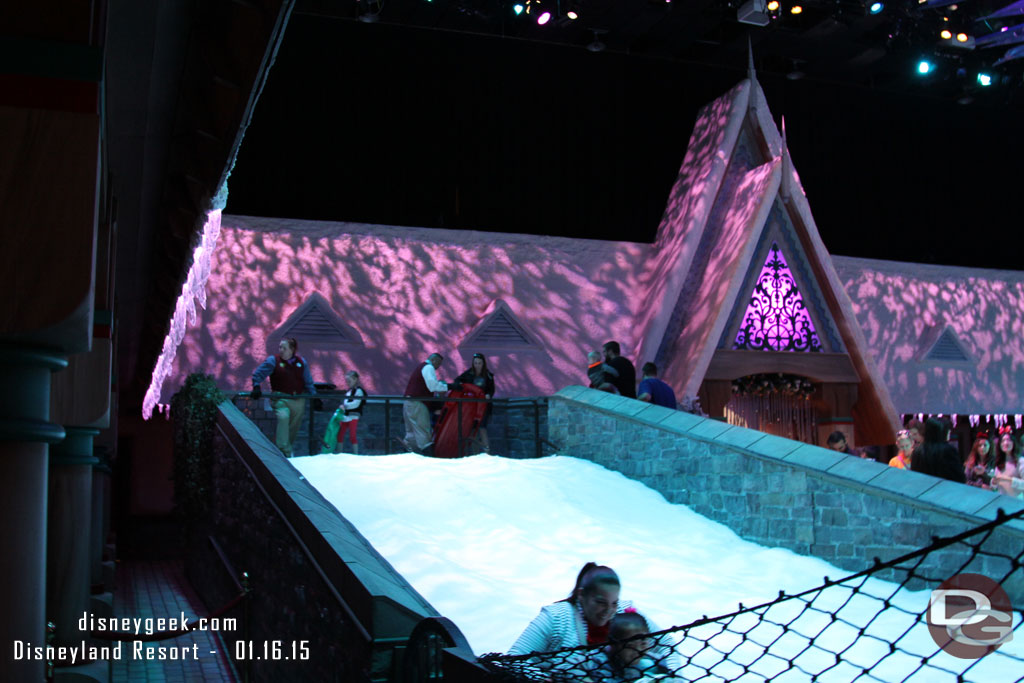 A small slope for sledding in the snow play area.