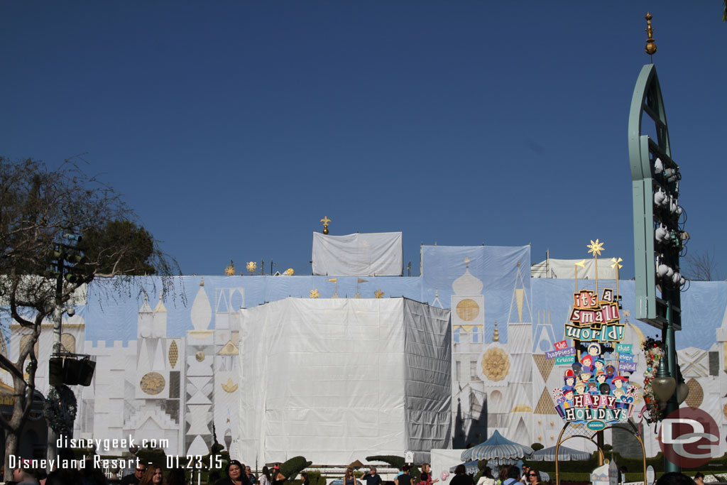 The white tarps now have a photo of the Small World Facade on them and the clock tower is covered.